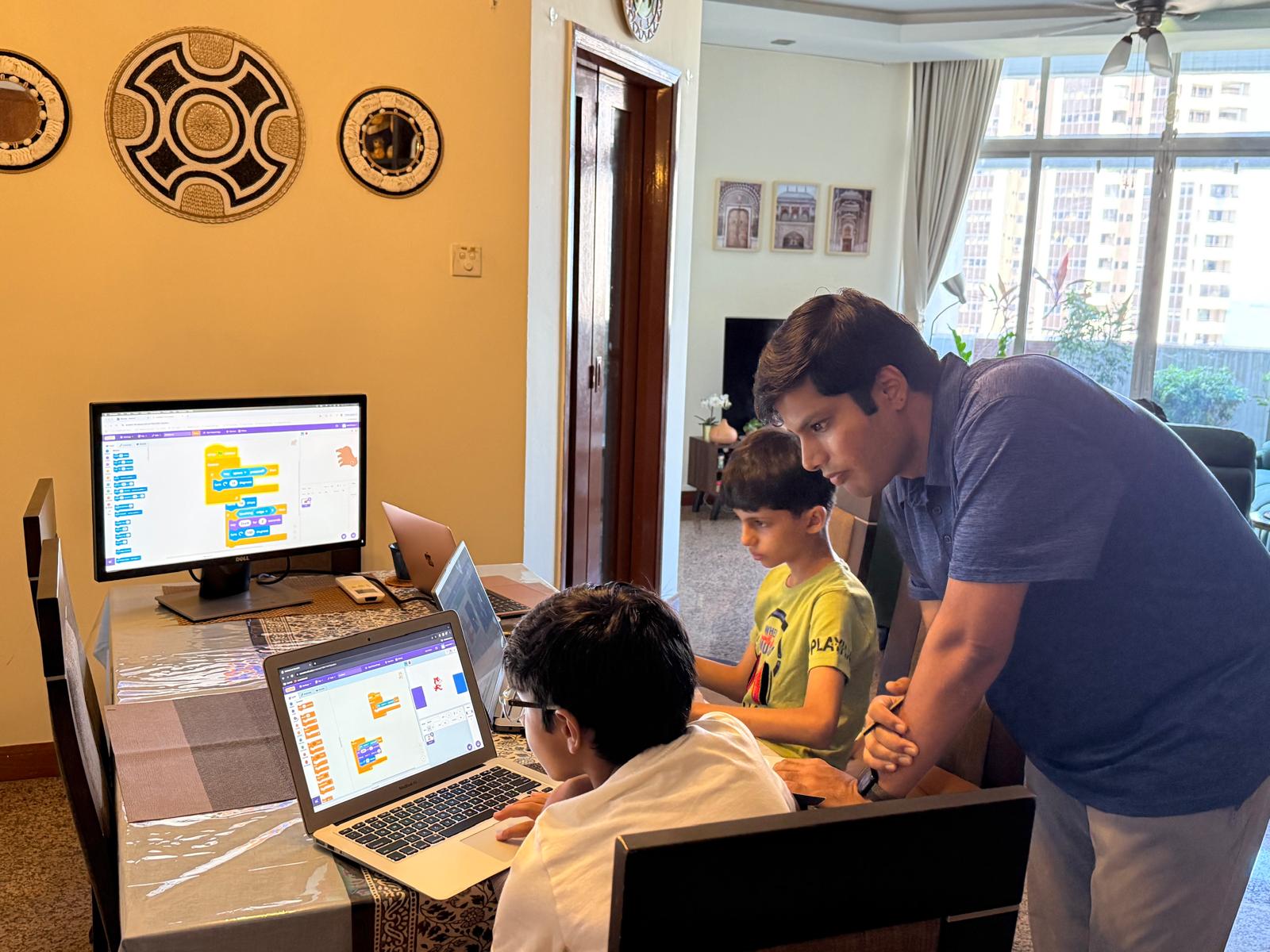 Kids engaged in learning Scratch